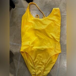 Yellow body suit. Tiger mist